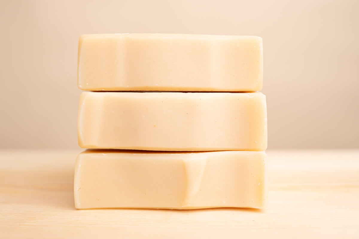 Pure tallow soap bar on rustic wooden surface